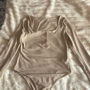 Cream colored bodysuit